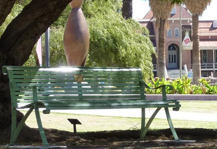 Image of bench in front of Old Main